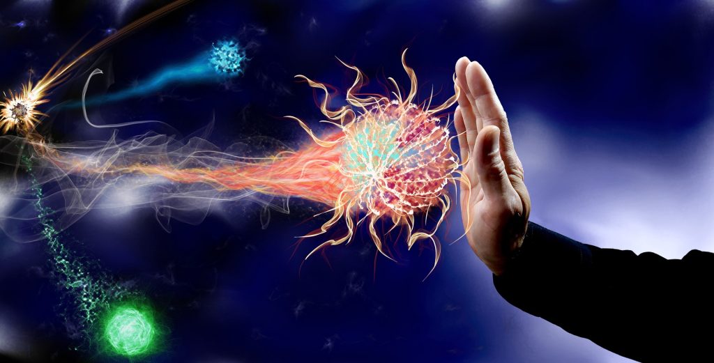 Hand raised to stop a bright, fiery orb-like energy burst against a dark blue background.