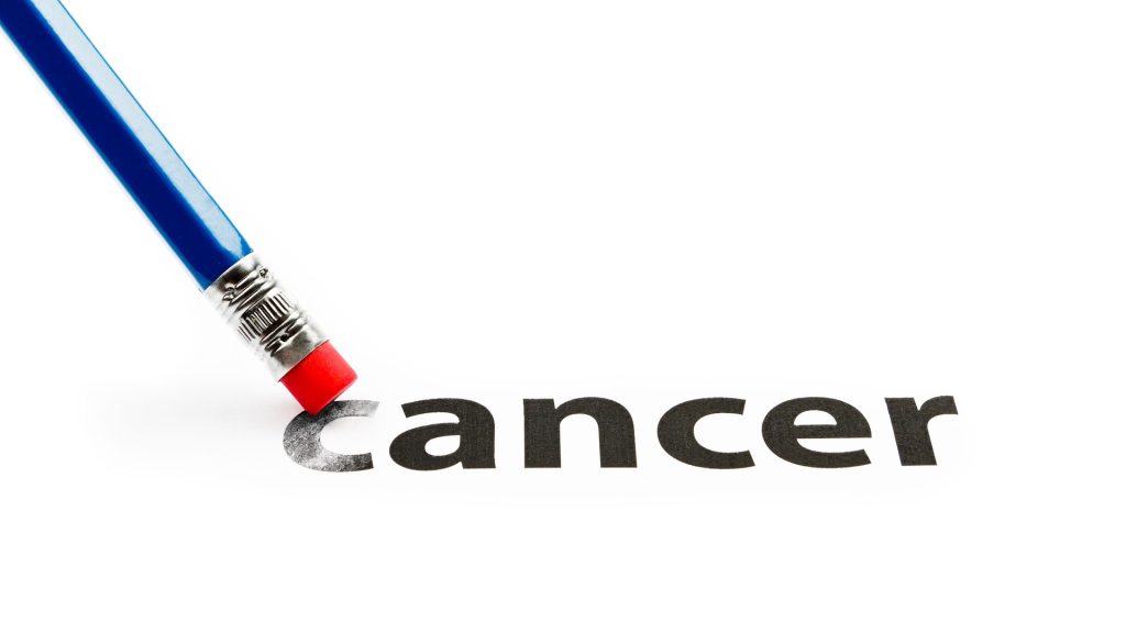Blue pencil with red eraser erases the word 'cancer' from a white page, symbolizing cancer prevention or elimination.
