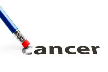 Blue pencil with red eraser erases the word 'cancer' from a white page, symbolizing cancer prevention or elimination.